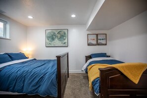 Discover Bedroom 3 with a single bed and double bed.