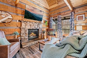 Snuggle up by the fire in the cozy living area