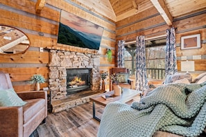Snuggle up by the fire in the cozy living area
