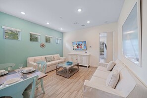 - Welcoming living area  of the townhouse in Kissimmee Florida - Experience comfort and convenience at the  living area - Entertainment meets relaxation, and every moment is effortlessly enjoyable