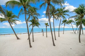 Swaying palms guide you to peace and powdery-soft white sands