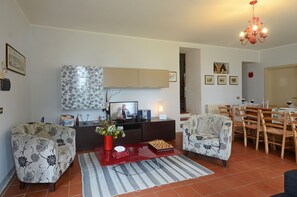 The dining room with a sofa two armchairs