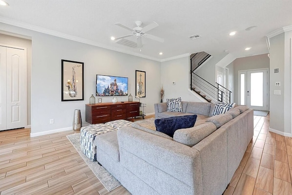 Our bright living area has a comfotable sofa, and leads to your lovely private pool.