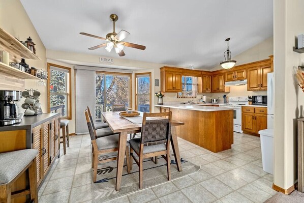 Spacious kitchen and dining area, perfect for family meals.