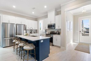Spacious Kitchen that is fully stocked including air frying oven, kitchen aid mixer, crock pot, coffee pot and single serve coffee maker, blender and much more!
