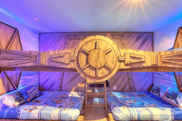 Join the gallatic battle of good vs evil in this icy frozen Star Wars scene. This beautiful custom bed features 4 full size beds sleeping up to 8 adults. Smart TV. En-suite master bathroom with double sinks.