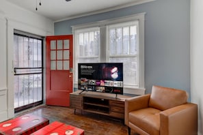 Unwind in a cozy space with Netflix and a relaxing vibe—perfect for a chill evening after a day of exploring Cooper-Young!