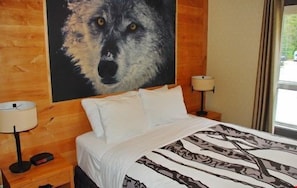 Drift to sleep in one of the comfortable bedrooms, featuring wolf-themed decor.