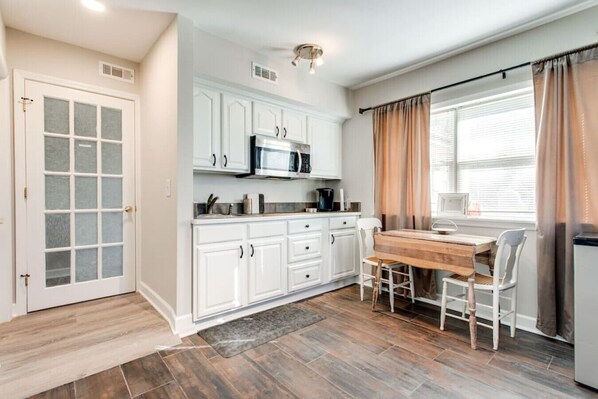 Entry door to the studio with a kitchenette.