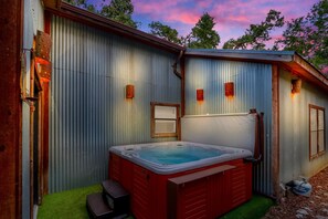 Private hot tub tucked away on the side of the house.