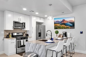 Kitchen island with bar stools