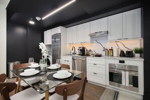 Dining table and chairsCook and dine in style with a fully equipped kitchen, complete with all utensils, an oven, and a cozy dining area.