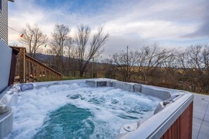 Soak, relax, and enjoy seasonal mountain views from our inviting hot tub