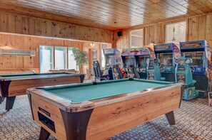 A BIG game room with pool tables and a lot of arcade games!