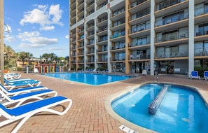 Large outdoor pool with lounge chairs and sun deck