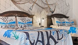 The 2nd bedroom area has 2 queen beds, a laptop area, & a private bath