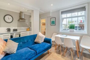 Open plan living with dining area for four people