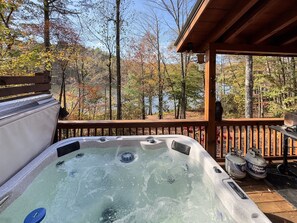 Hot tub on the deck also has a view of the lake.