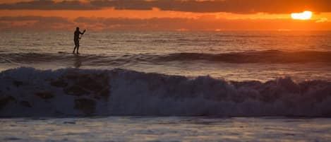 Paddleboarding at sunrise.