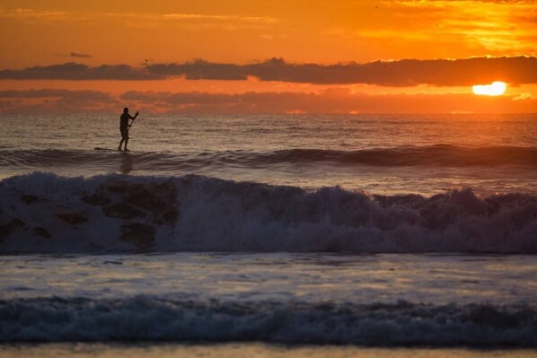 Paddleboarding at sunrise.