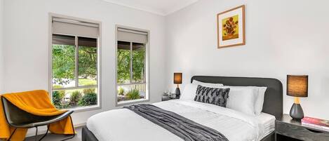 The light and airy primary bedroom features a queen-size bed as well as a pristine ensuite for privacy and ease. 
