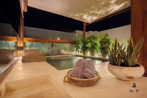 Your private spa tub awaits under the pergola.
