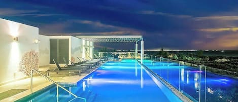 Swim high above the city in the rooftop pool.