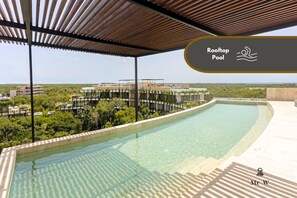Swim with a view in the rooftop pool.