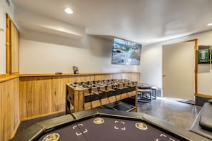 Game room with TV, multi-game table, and poker table.
Note: this is not located in the main house but down a path from the front door.