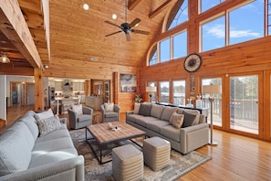Main level living room with wall of windows.