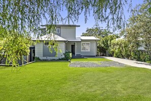 View of the front grass area and house