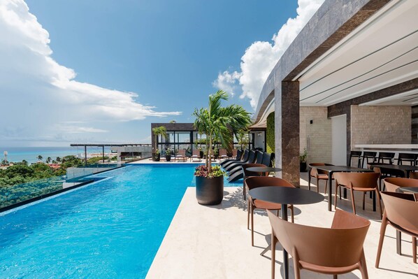 Take a dip in the ocean view rooftop infinity pool