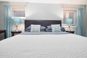 Comfy bedding with fluffy pillows.