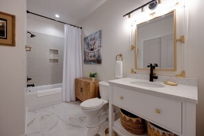 Discover the allure of minimalistic design! Embrace the timeless beauty of this white bathroom adorned with exquisite marble floors, harmonizing simplicity with style effortlessly. A serene oasis for your daily routines!