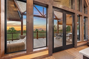 A wall of windows overlooking untouched nature.