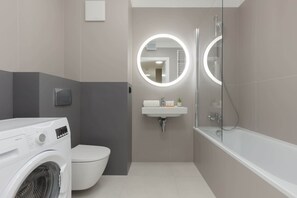 Well-equipped bathroom with shower