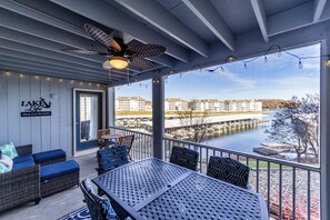 Spacious deck with outdoor seating and beautiful lake view