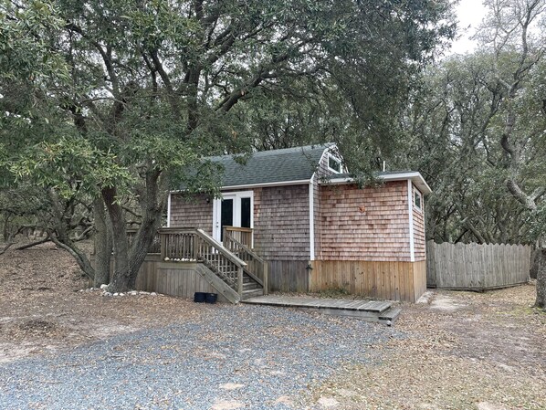 Cottage tucked in the trees.