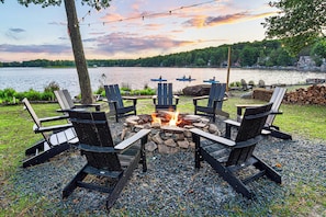 This large fire pit and lounge area sits just beside the lake.