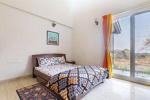 Bedroom with Queen Bed on upper floor with ensuite washroom and balcony