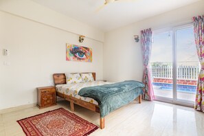 Bedroom with King Bed on Ground Floor with ensuite washroom and access to pool.