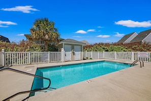 Enjoy a refreshing swim or relax poolside in this sun-soaked space—perfect for unwinding after a day at the beach.