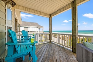 Gather with loved ones on the shaded deck, where ocean breezes and comfortable seating create the ideal space to unwind.