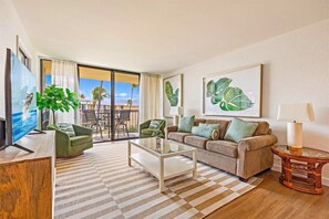 Unwind in our bright and airy living space! Step onto the balcony and soak in the island views.