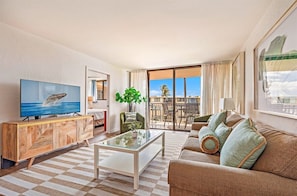 Relax in our comfy living area after a day of island fun! Step onto the lanai for fresh air and island vibes.