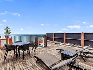 Private Rooftop deck overlooking gulf front beach/Colorful Mile Marker sign