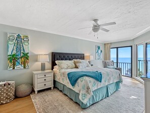 King bed in master bedroom with beach and lanai views