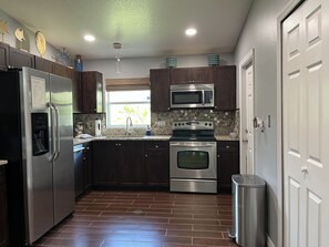 Kitchen - stocked with everyday kitchen tools and utensils
