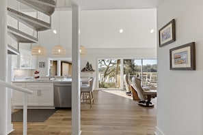 Hallway view, kitchen on left, living room on right
