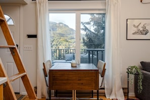 Cute dining area with seating for two and views of Rainbow Mountain